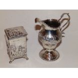 A George III embossed silver cream jug – London 1774 and a Birmingham silver square caddy – caddy