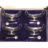 A cased set of four canoe shaped silver salts – Goldsmiths & Silversmiths, Sheffield 1910.