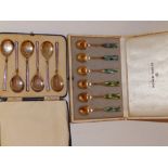 A cased set of Georg Jensen gilt 'Sterling' metal coffee spoons, the handles with harlequin diaper