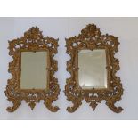 Two gold painted scrolling metal frame wall mirrors, 20” high.