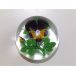 A Baccarat pansy paperweight on star cut base, 3”.