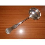 A Danish white metal soup ladle.