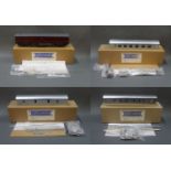 A group of 3 boxed and unassembled GM coaches 0 gauge coach kits and an assembled GM coaches 0