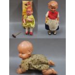 A Japanese wind up celluloid crawling baby, measuring 13cm long,