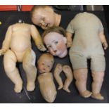 A box of composition doll bodies,