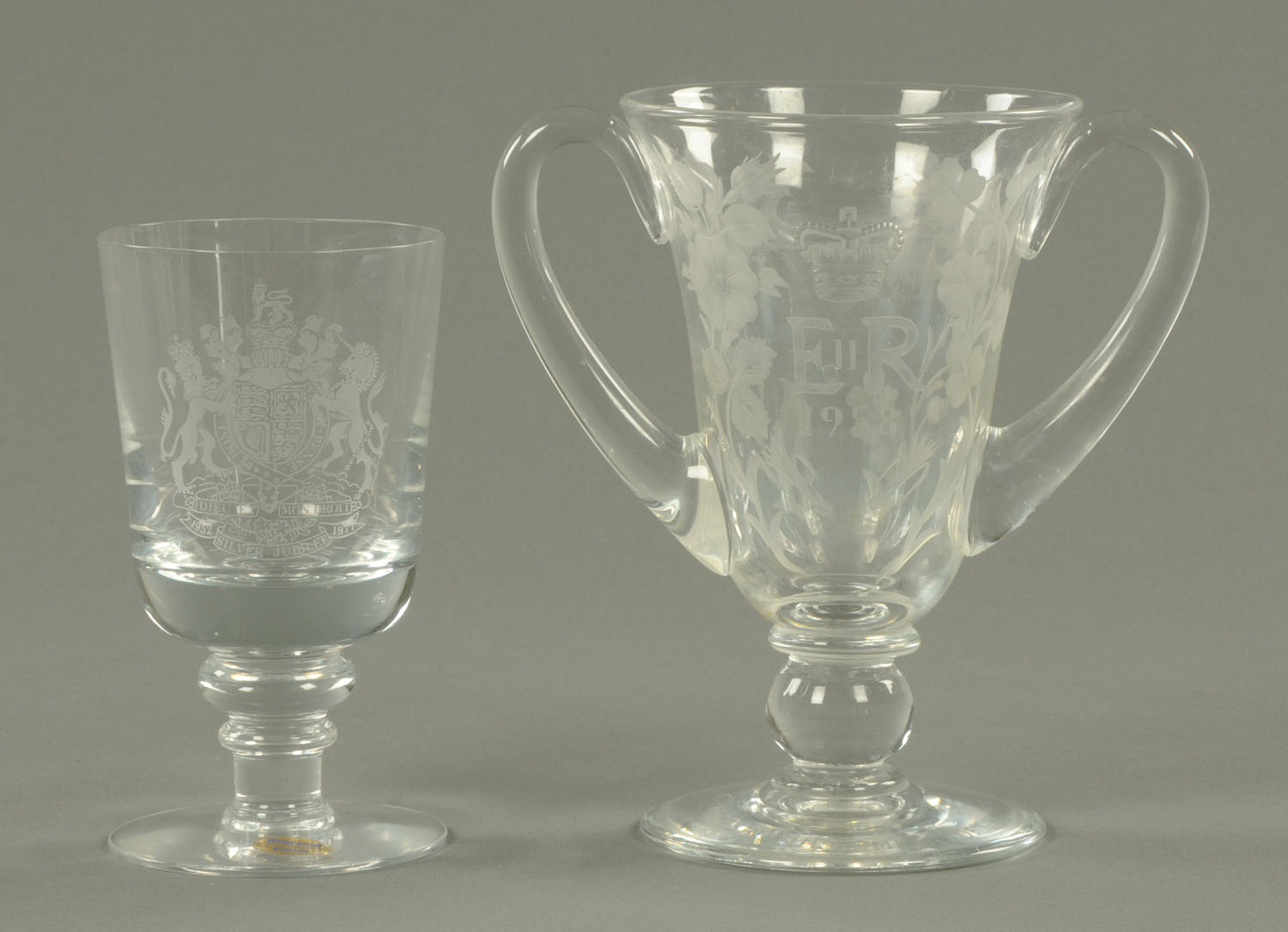 A Wedgwood Queen Elizabeth Silver Jubilee goblet, and an etched Coronation two handled goblet.