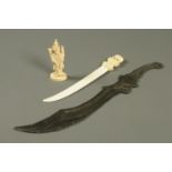 An early 20th century carved ivory letter knife, probably Indian,