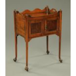 A Georgian mahogany bedside cabinet, with carrying handle to either side,