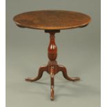 A George III mahogany tripod table, with oval top with bird cage support,