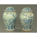 A pair of Chinese blue and white meiping and covers, 20th century, decorated with kylin.