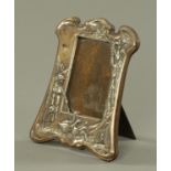 An Edwardian silver plated and embossed photograph frame, circa 1905,