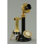 A vintage brass mounted candlestick telephone, converted for modern use.