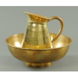 A brass wash jug and bowl, late 19th century,