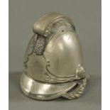 A part chromium plated inkwell, in the form of a fireman's helmet. Height 9.5 cm.
