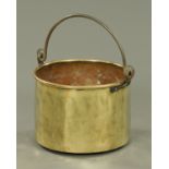 A large brass log bin, Victorian, with iron loop handle. Diameter 45 cm.