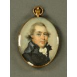A portrait miniature on ivory, gentleman, early 19th century, mounted in copper frame and backing,