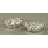 A pair of silver bonbon dishes, Charles S. Green & Co. Ltd., Birmingham 1920, with pierced sides.