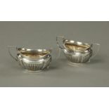 A pair of silver salts, half lobed, Birmingham 1905, 66 grams. Length 98 mm.