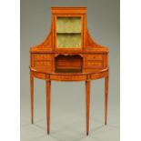 A late Victorian/Edwardian Sheraton Revival satinwood combined writing desk/display cabinet,