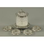 A Victorian cut glass and silver plate mounted biscuit barrel, on four claw and ball feet,