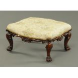 A Victorian rosewood stool, shaped outline,