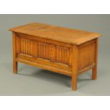 An oak coffer, with three panelled linen fold front. Width 92 cm.