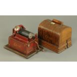 A late 19th century Edison Gem four and two minute phonograph, oak cased, with 13 wax cylinders.