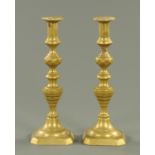 A large pair of Victorian brass candlesticks. Height 34 cm.