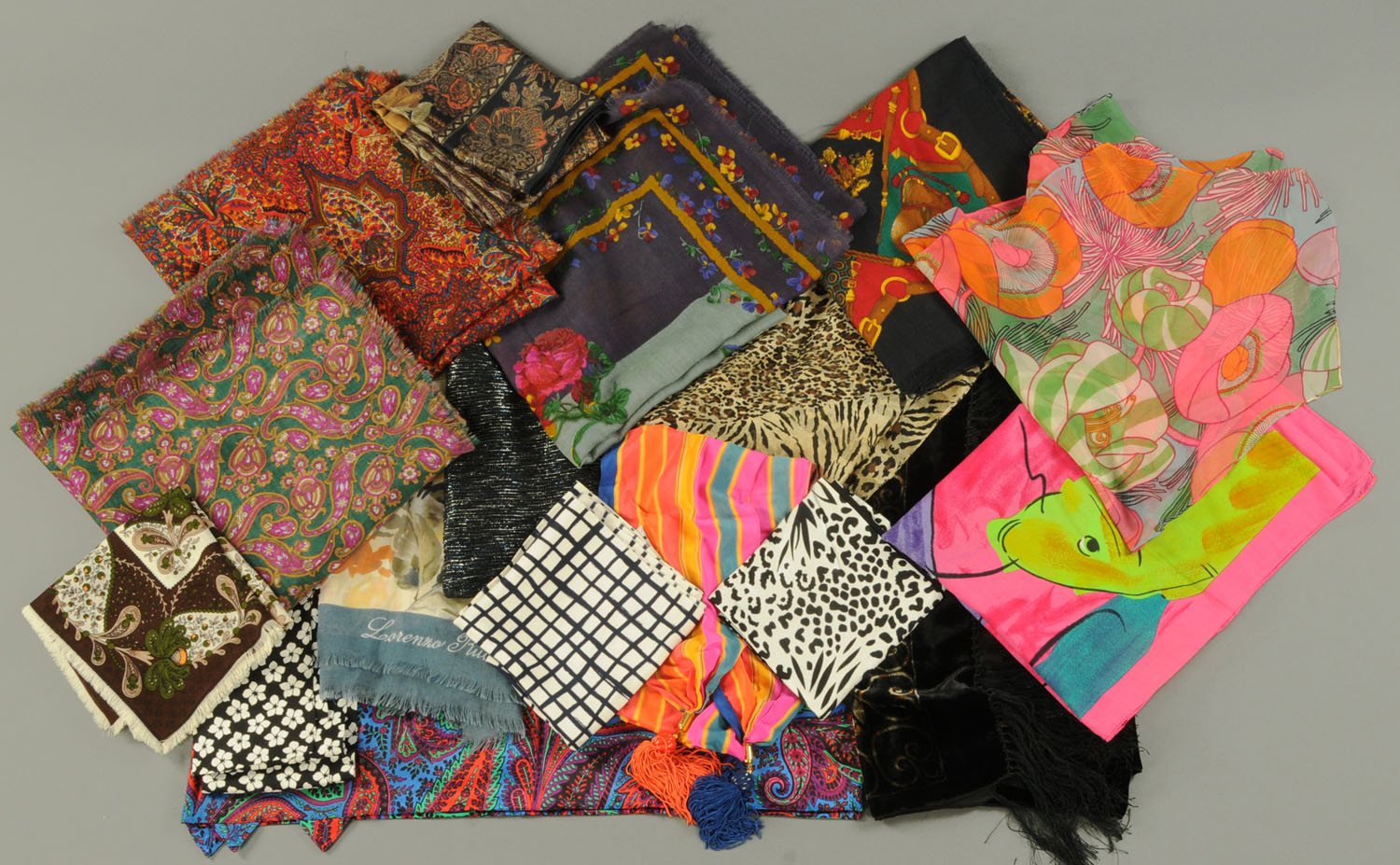 Seven silk cotton and other evening scarves, and ten further scarves, to include paisley pattern,