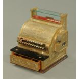 A National brass cash register, bearing plaque "Stevensons, 2527053 345" (see illustration).