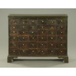 A 19th century painted pine flight of drawers,