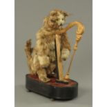 A 19th century musical automaton, in the form of a cat playing a harp,