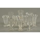 Nineteen wine glasses, and a short vase, 19th century. Tallest 14.5 cm.