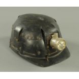 A vintage miners helmet, by Huwood "Light Type Hat".