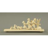 A carved ivory nursery rhyme group, circa 1920/30,