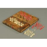 A Victorian leather bound book form chess and backgammon board,