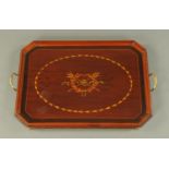 An Edwardian inlaid mahogany tray, rectangular, with canted angles and brass carrying handles.