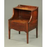 A Regency mahogany commode, with hinged top and raised on tapered legs of square section.