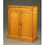 A satin birch cupboard in the manner of Holland,