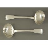 A pair of George IV silver sauce ladles, London 1823, probably William Johnson, 108 grams.