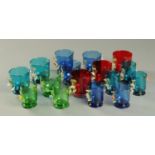 Sixteen Victorian coloured glasses, each with applied foliate decoration.