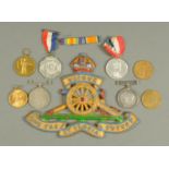 A Royal Artillery metal plaque, length 20 cm, various Second World War medals,