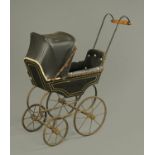 A Victorian child's toy perambulator, with upholstered interior, wooden panelled sides,