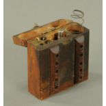 A First World War pistol cleaning set, in wooden case. Case dimensions 10 cm x 10 cm x 4 cm.