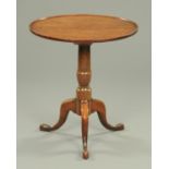 A George III mahogany tripod table, with dished top,