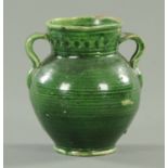 An antique Chinese green glazed two handled pot, possibly 17th century,