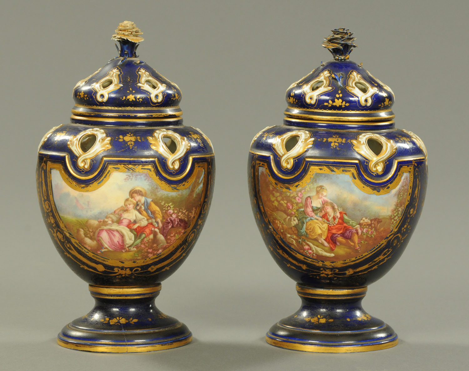 A pair of Sevres style pot pourri vases and covers, 19th century,