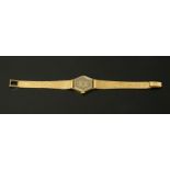 A 9 ct gold and diamond cased ladies wristwatch, with 9 ct gold mesh strap,