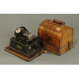 A late 19th century Edison Gem cylinder phonograph, oak cased, 15 wax cylinders.