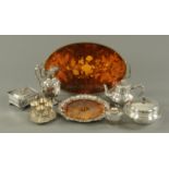 An assortment of silver plate, comprising oval shaped tea caddy, Elkington's melon form teapot,